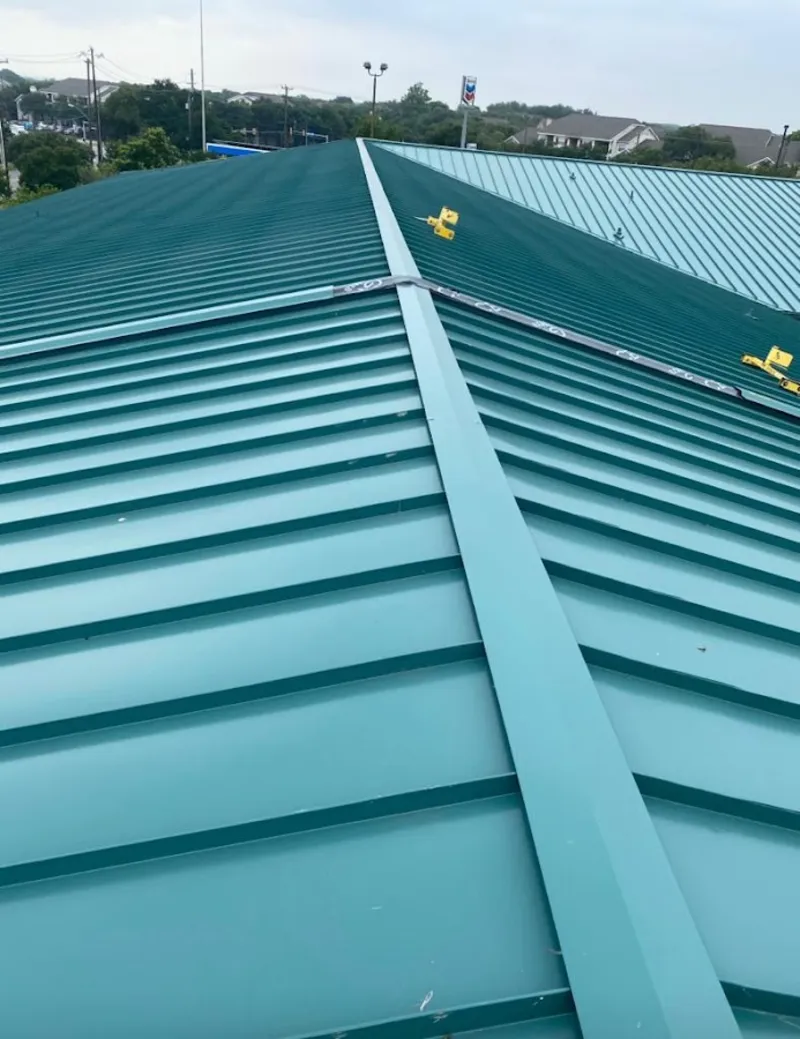Green commercial metal roof ridge and valley for Metal Roof Repair in Hurley