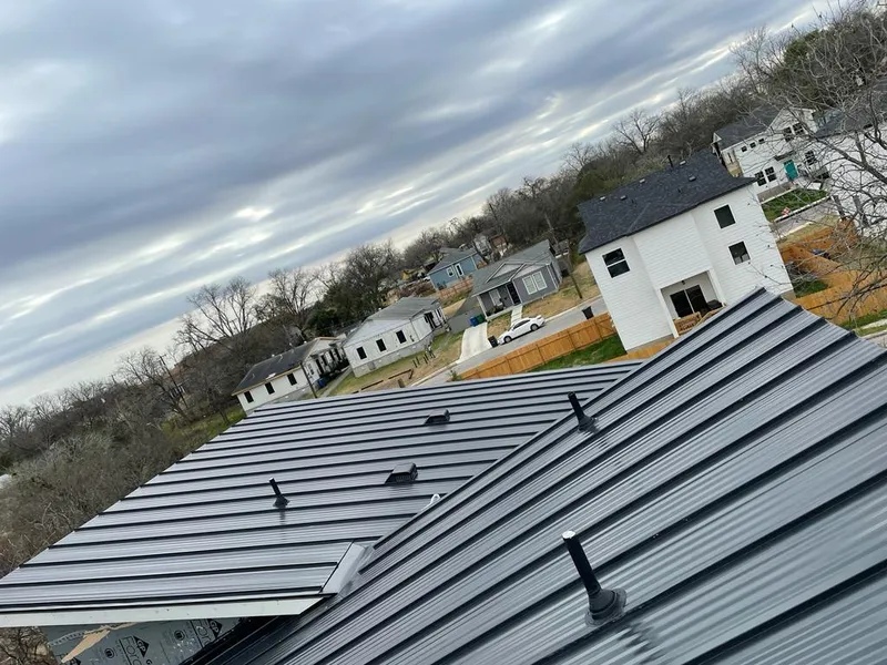 Standing seam metal roof panels with vents for Skylight Repair in Hurley